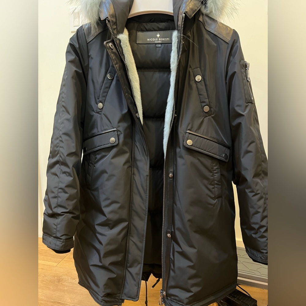 Designer down filled parka with fur trim and attached hood.